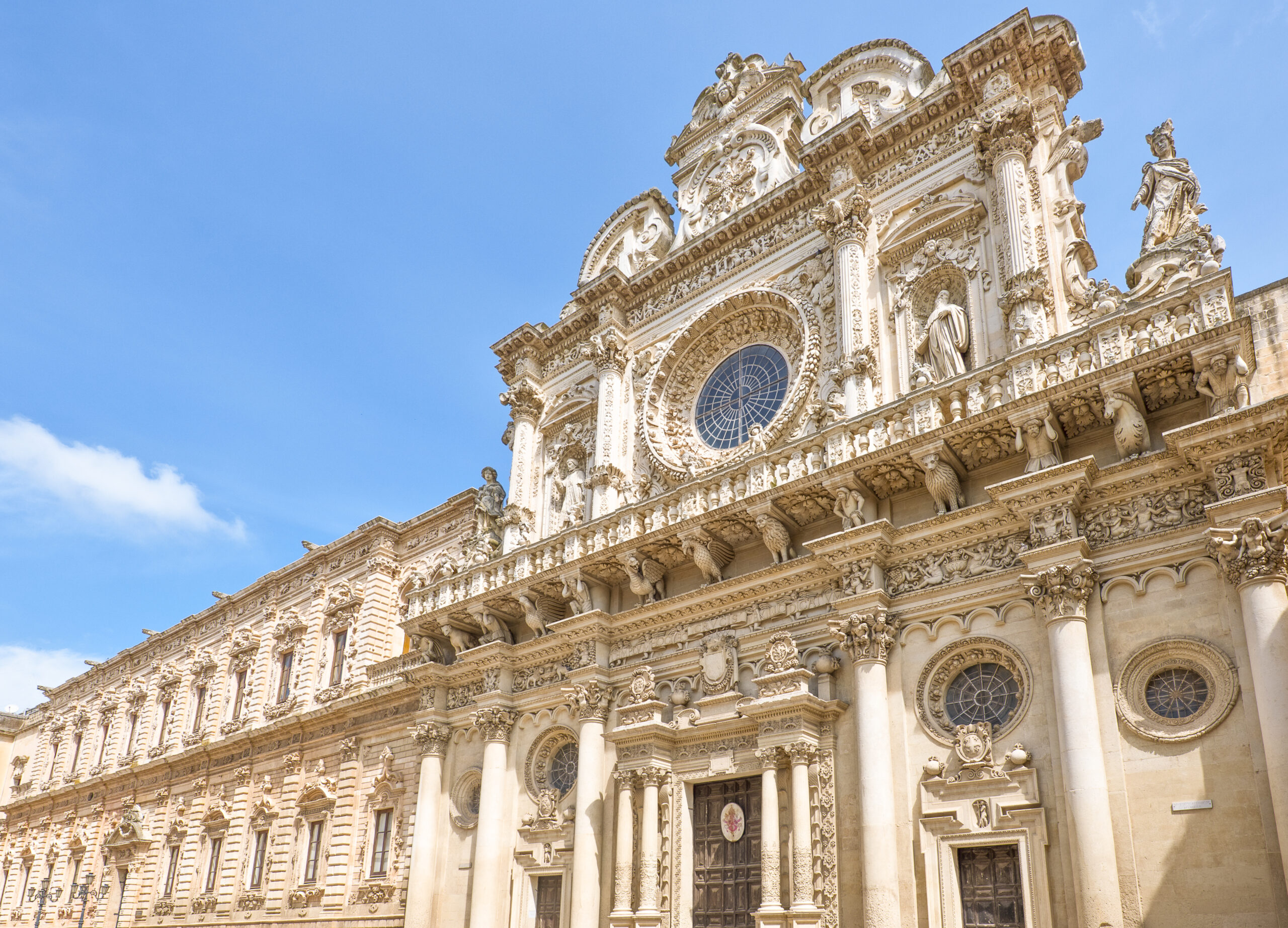 Lecce, Italy,  the full of sculpture facade of the Santa Croce Basilica