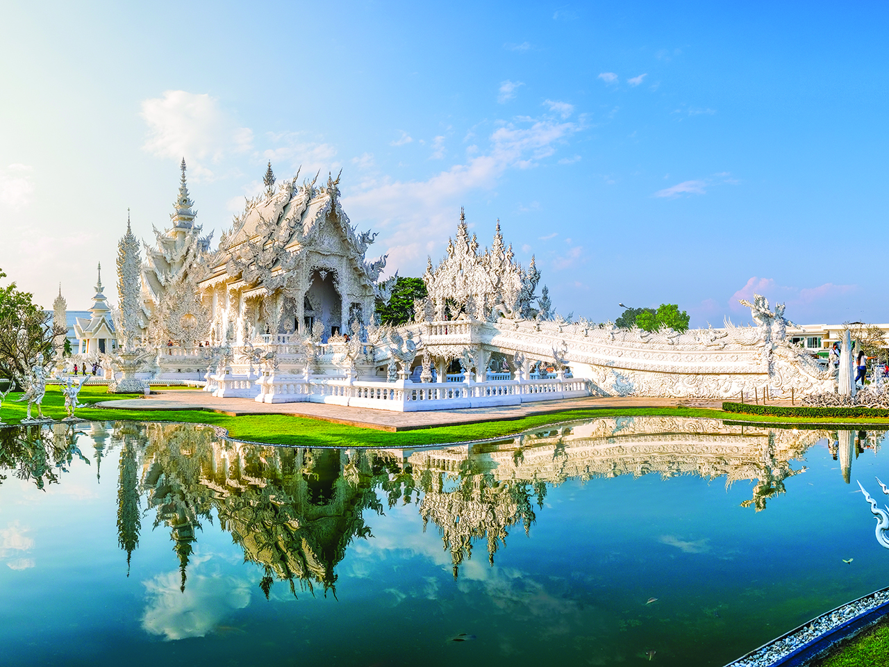 White Temple Chiang Rai Thailand, Wat Rong Khun Northern Thailand with reflection in the pond, panoramic view