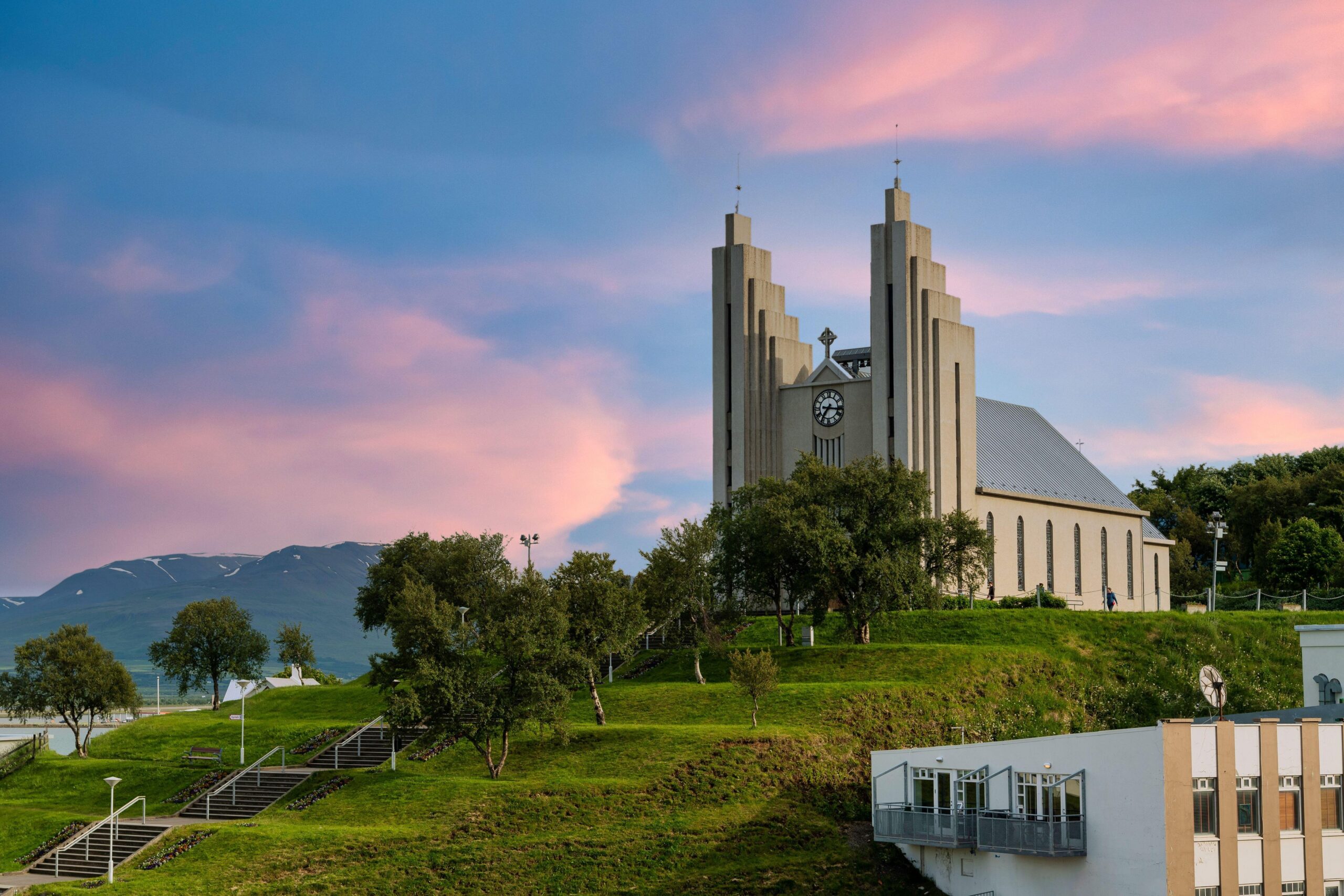 2C9KGE5 Akureyrarkirkja Lutheran Church This is an important and popular landmark of Akureyri city in Northern Iceland, in the evening sky blue vanilla. In th
