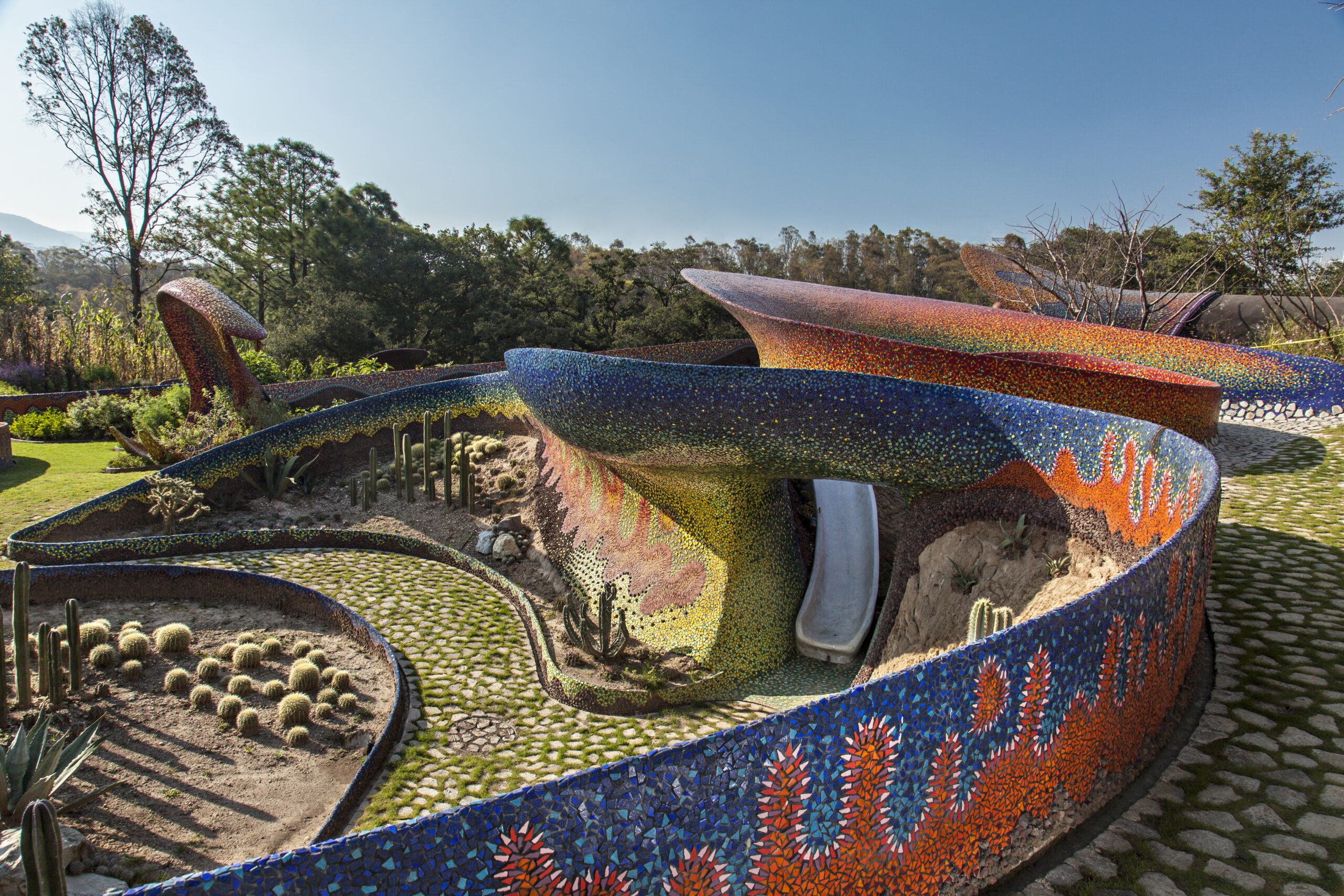Multicolor mosaic snake architecture building in Mexico